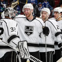 Jeff Carter (#77) congratulating goaltender Jonathan Quick (#32).
