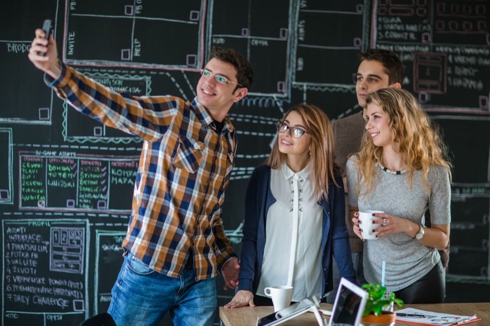 Business people taking selfie of themselves in the office