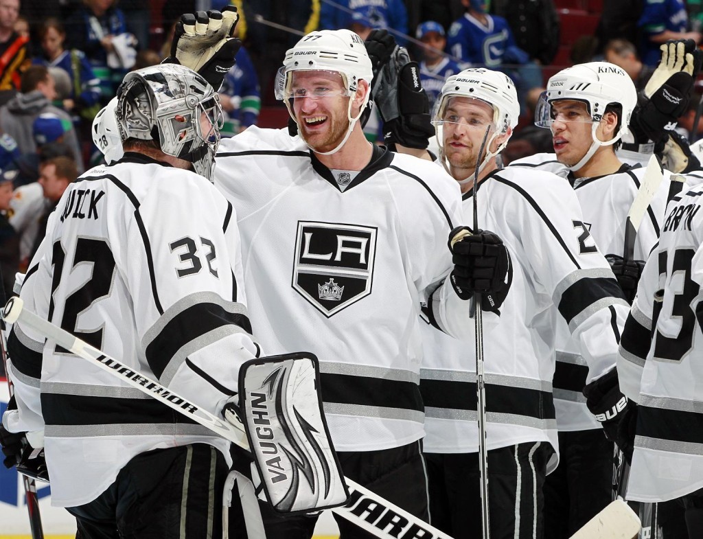 Jeff Carter (#77) congratulating goaltender Jonathan Quick (#32).